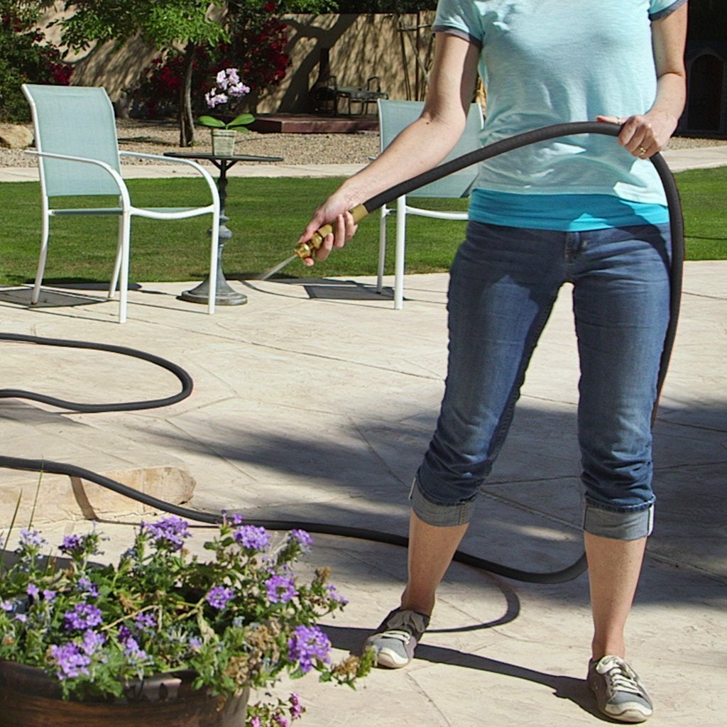 Pocket Hose Brass Bullet lady watering flowers